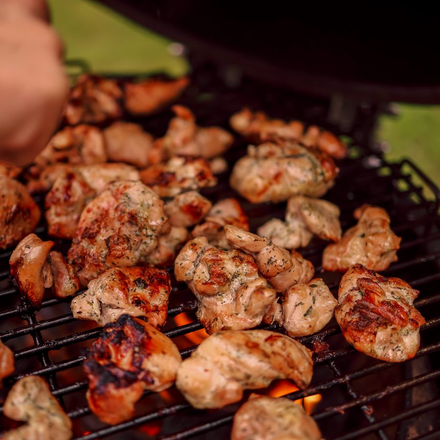 Chicken thighs charring on the grate