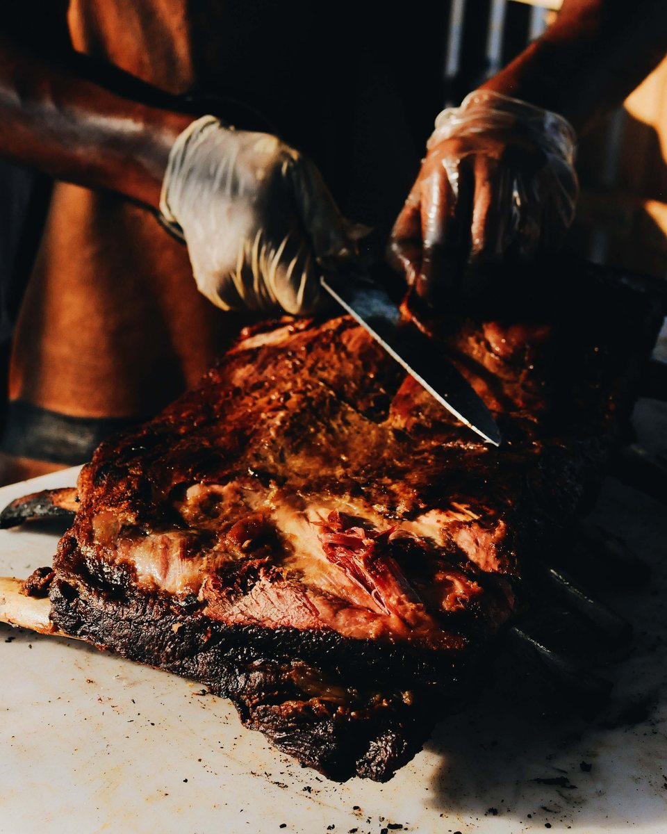 Slicing a smoked brisket on the cutting board